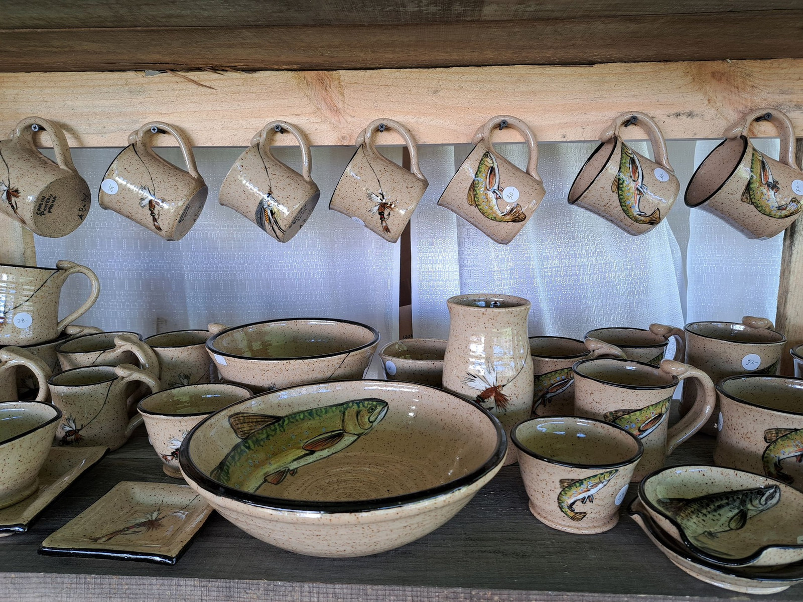 Handmade pottery arranged on display