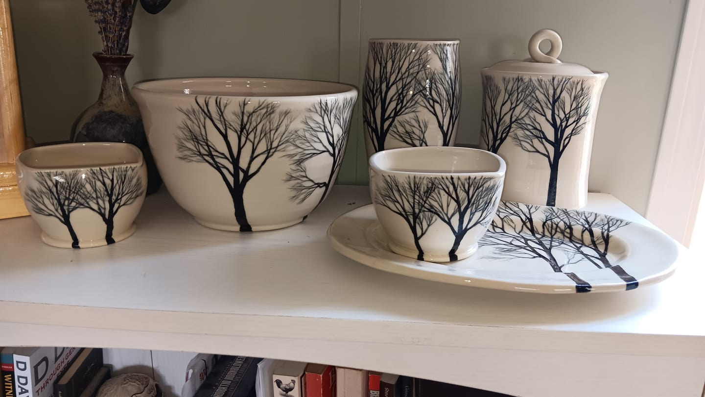 White stoneware with woodland designs