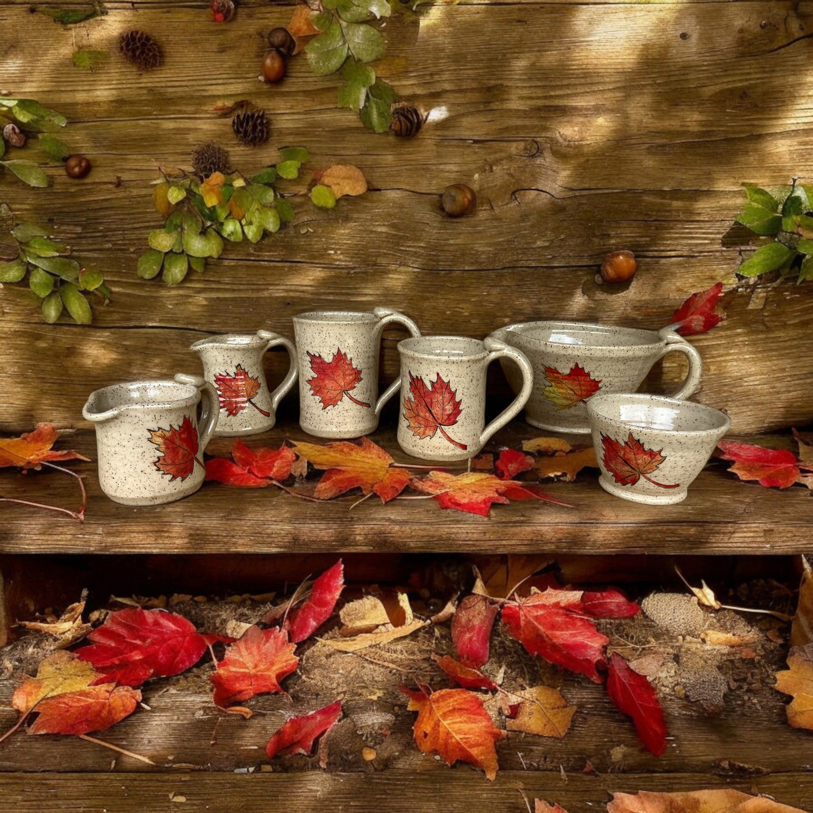 Hand-painted maple leaf mugs in autumn