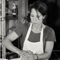 Andrea Bredeau painting pottery