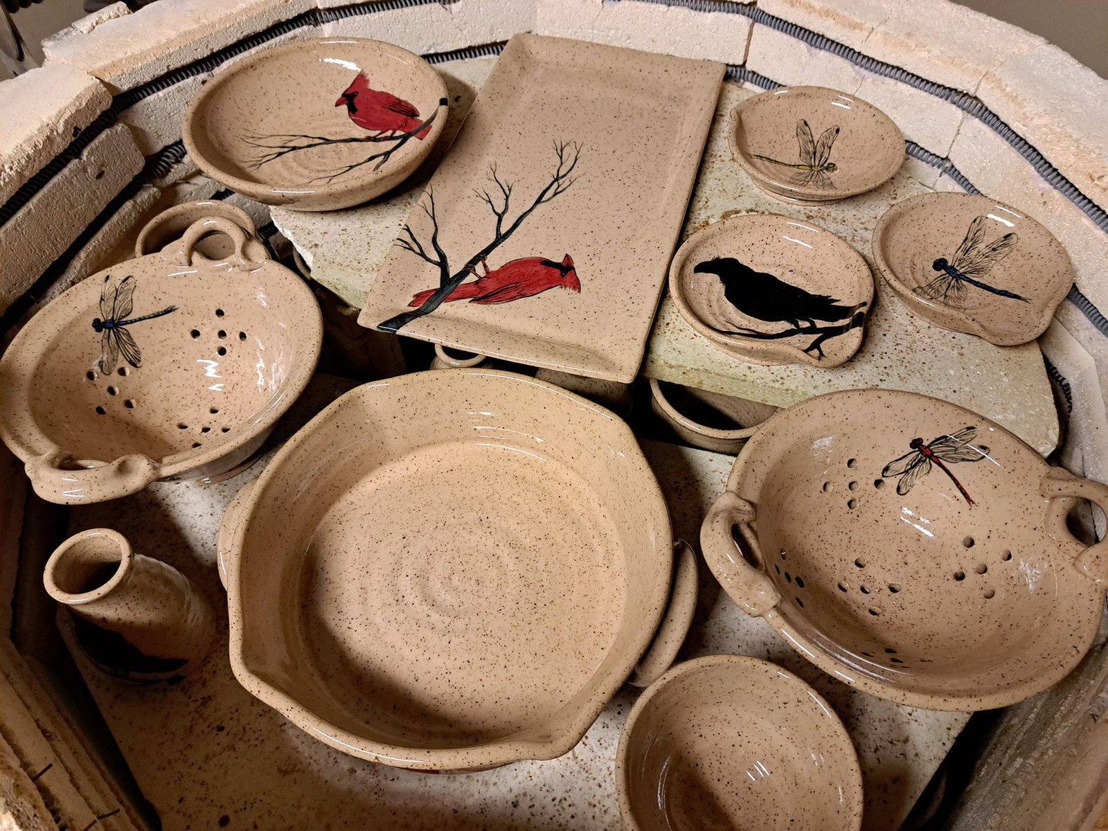 Handmade bowls and plates with woodland motifs