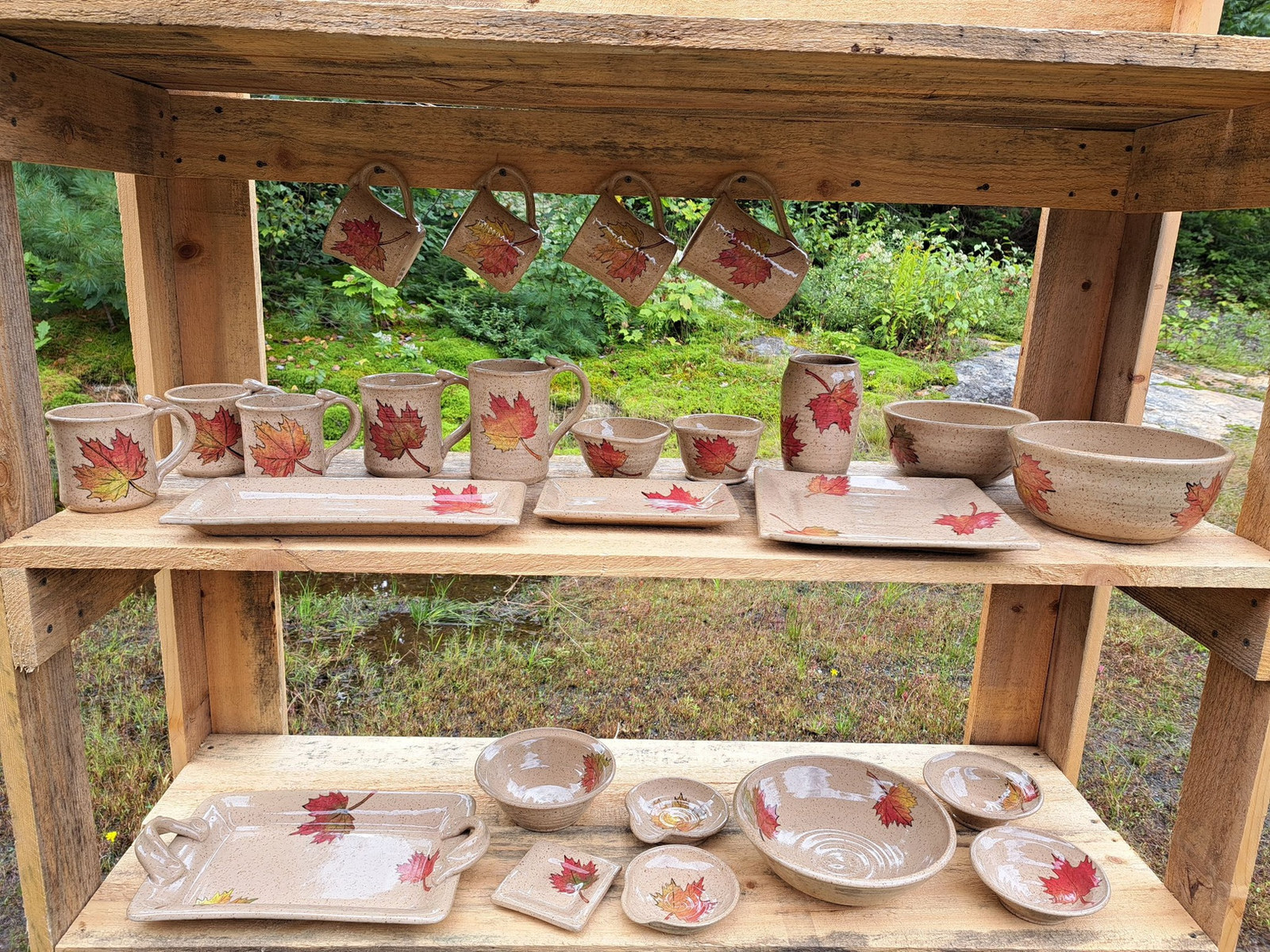 Outdoor display of Cabin Pottery pieces
